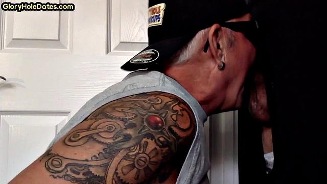 Gloryhole tattooed DILF sucks cock in private amateur BJ