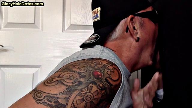 Gloryhole tattooed DILF sucks cock in private amateur BJ
