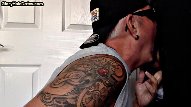 Gloryhole tattooed DILF sucks cock in private amateur BJ