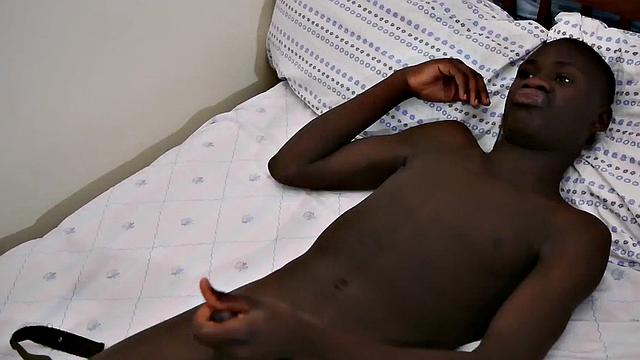 Ebony twink from Africa wanks and cums in solo action