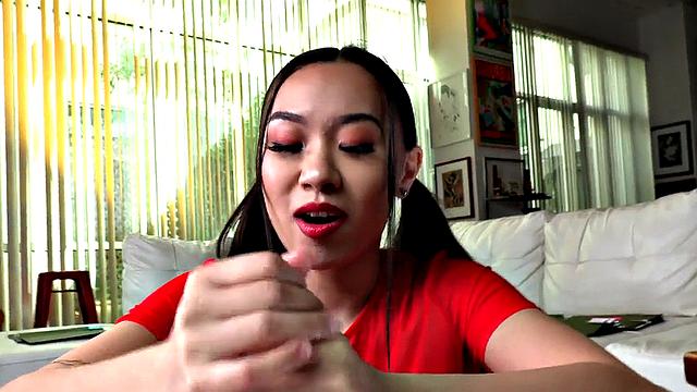 Teasing Asian domina wanks cock in POV handjob