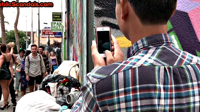 BDSM public slut with small boobs whipped outdoors on street