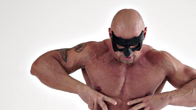 Muscled hunk with eye mask wanks in solo action