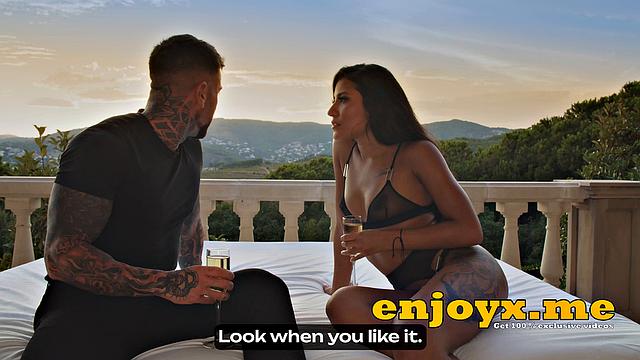 Andrea Retali, a Spanish brunette with long dark-hued hair, indulges in outdoor sex as the sun sets and inflames her desires.