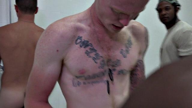 Black army stud fucked by colleague in shower orgy