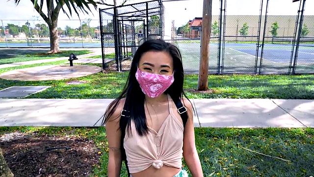 Asian teen with small tits takes a hard pounding in the car in POV