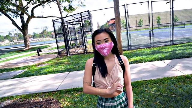 Asian teen with small tits takes a hard pounding in the car in POV