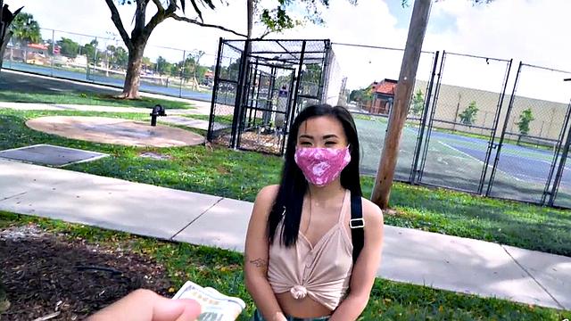 Asian teen with small tits takes a hard pounding in the car in POV