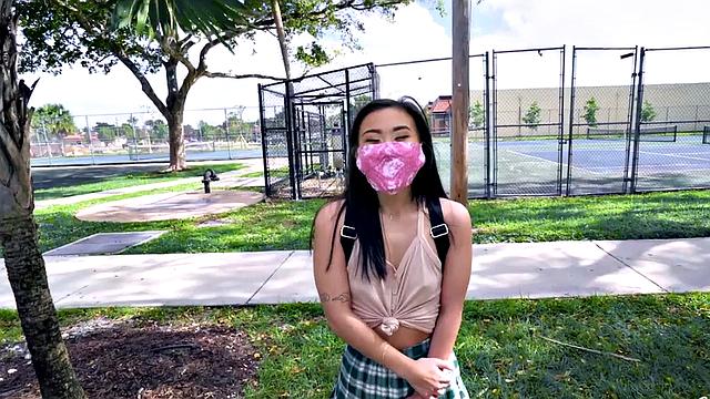 Asian teen with small tits takes a hard pounding in the car in POV