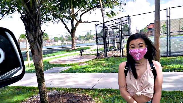 Asian teen with small tits takes a hard pounding in the car in POV