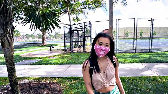 Asian teen with small tits takes a hard pounding in the car in POV