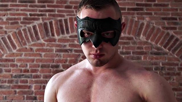 Masked athletic jock wanks cock and cums in solo action