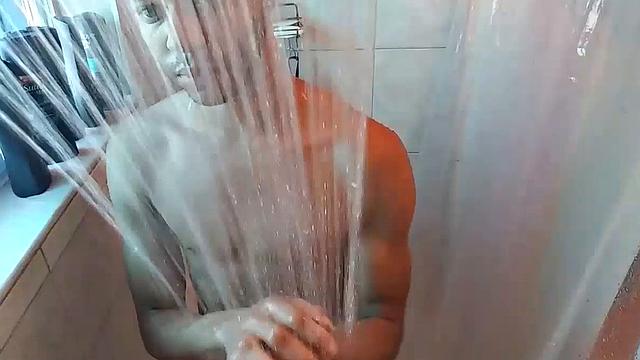 Naked in the shower, Calvin Collins soaps down his smooth ebony body, before giving his big cock some attention. We enjoy a good look at his little butt, before Calvin gets busy jerking himself off.