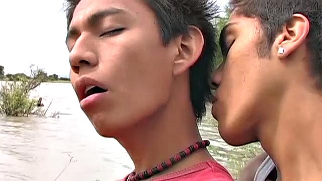 Latin twinks Jonathan and Andres are on the banks of a river for an afternoon of fishing. At some point, lust takes over and the two start kissing. Soon both have big boners popping out of their shorts and it isn't long before they are naked.