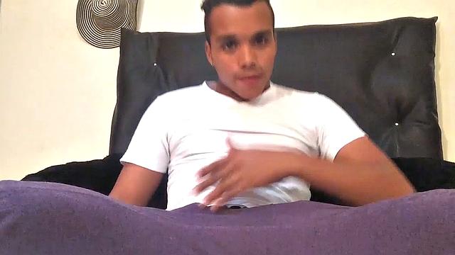Our featured solo boy of the week is Jason Ben, a sexy young Latino with a boner in his pants. When he pushes them down, a big stiff uncut dick pops otu, ready for action.