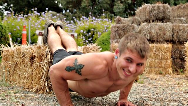 Shaved amateur solo masturbates on the gym bench