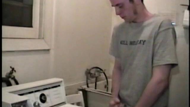 Boy-next-door spreads his new straight porn magazine on top of the washing machine and pulls his cock out of the fly.