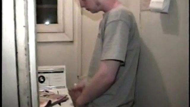 Boy-next-door spreads his new straight porn magazine on top of the washing machine and pulls his cock out of the fly.