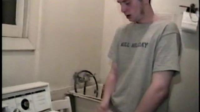 Boy-next-door spreads his new straight porn magazine on top of the washing machine and pulls his cock out of the fly.