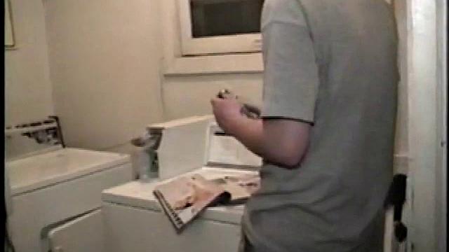 Boy-next-door spreads his new straight porn magazine on top of the washing machine and pulls his cock out of the fly.