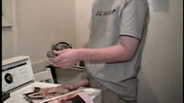 Boy-next-door spreads his new straight porn magazine on top of the washing machine and pulls his cock out of the fly.