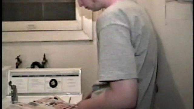 Boy-next-door spreads his new straight porn magazine on top of the washing machine and pulls his cock out of the fly.
