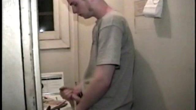 Boy-next-door spreads his new straight porn magazine on top of the washing machine and pulls his cock out of the fly.