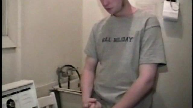 Boy-next-door spreads his new straight porn magazine on top of the washing machine and pulls his cock out of the fly.