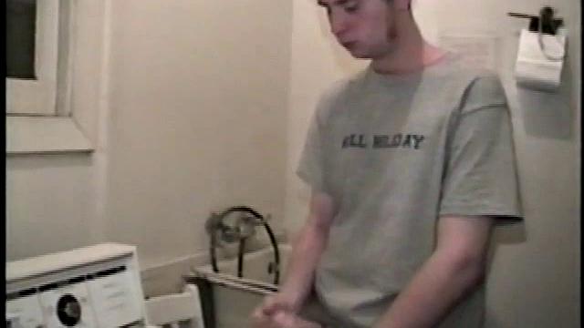 Boy-next-door spreads his new straight porn magazine on top of the washing machine and pulls his cock out of the fly.