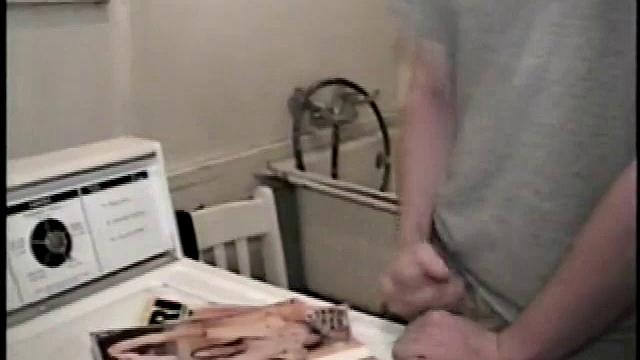 Boy-next-door spreads his new straight porn magazine on top of the washing machine and pulls his cock out of the fly.