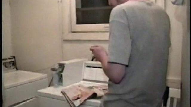 Boy-next-door spreads his new straight porn magazine on top of the washing machine and pulls his cock out of the fly.