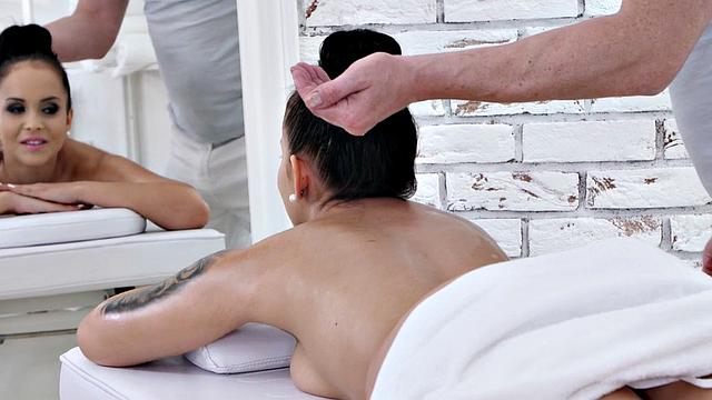 Oiled tattooed babe squirts during fuck massage