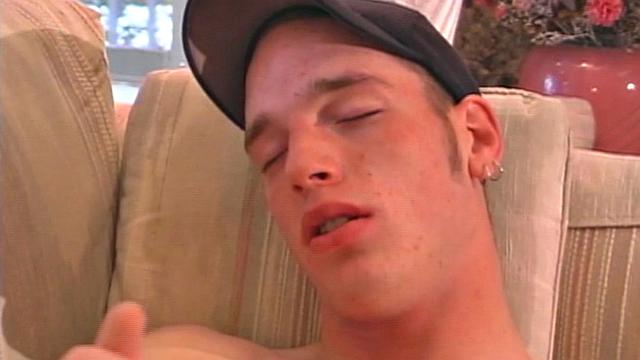 Jaison Lawrence flips through magazine, works himself stiff, naked on the sofa and stroking his big 8 inch dick