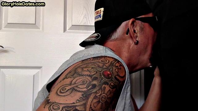 Inked gloryhole DILF sucks cock till jizz in mouth