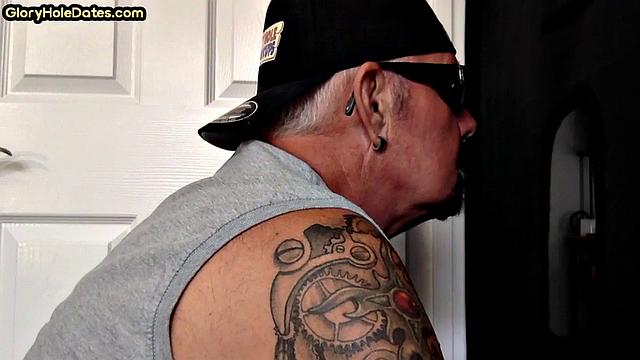 Inked gloryhole DILF sucks cock till jizz in mouth