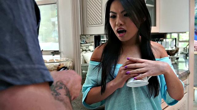 Watch this tattooed Asian cutie get stuffed with cock while giving a hot standing 69