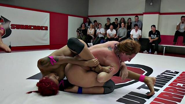 Naked wrestling dykes perform pussyfingering in public