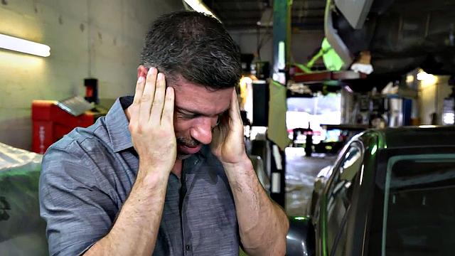 Tattooed stud in the ass fucks muscular nympho in a bareback garage doggystyle