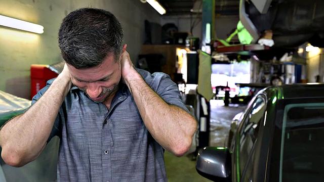 Tattooed stud in the ass fucks muscular nympho in a bareback garage doggystyle