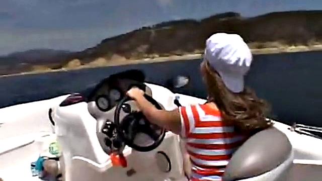 Sexy Little April playing with her snatch outdoors in rubber boat