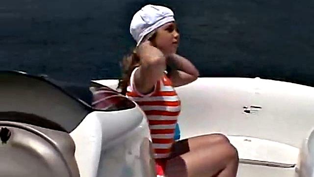 Sexy Little April playing with her snatch outdoors in rubber boat