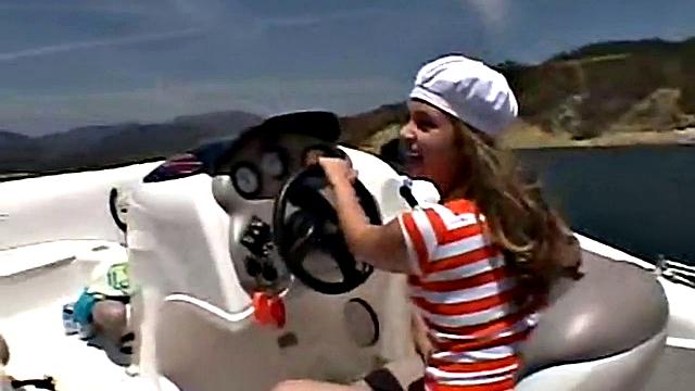 Sexy Little April playing with her snatch outdoors in rubber boat