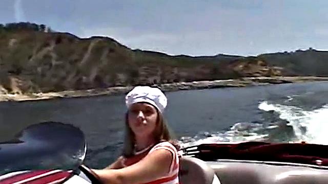 Sexy Little April playing with her snatch outdoors in rubber boat