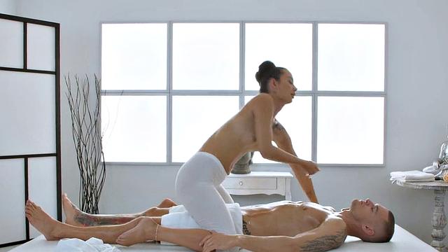 Oiled masseuse pleasing client with her perfect pussy