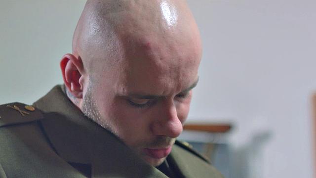 Young soldier Ryan Olsen is summoned to the old man's office, where General Alex Hell gives him a verbal bashing. He then gives a hard spanking to the young man, first with a leather strap, followed by his big hand.