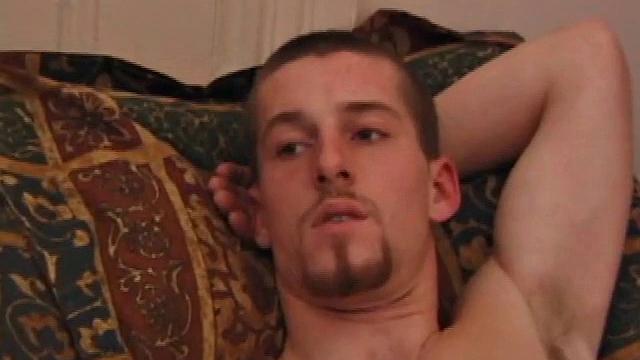 Adam pulls off his clothes and lubes up his cock as he watches a porn video. He strokes his dick for a while before using a massive dildo on himself.