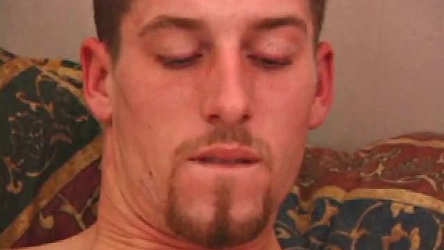 Adam pulls off his clothes and lubes up his cock as he watches a porn video. He strokes his dick for a while before using a massive dildo on himself.