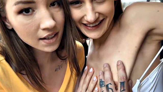 Skinny babes in car kissing and cuddling in front of voyeur