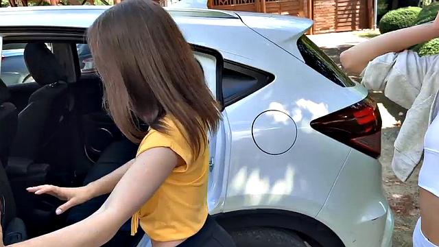 Skinny babes in car kissing and cuddling in front of voyeur