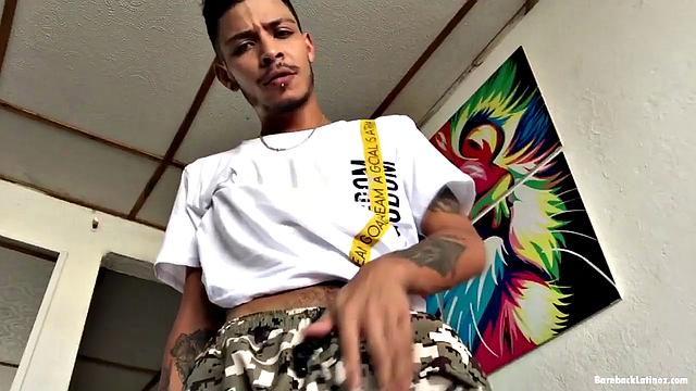 Latin boy Juan works up a stiff one and pushes his pants down just enough to release it. After stroking himself a bit, the skinny boy turns around to show off his butt and then gets back to giving his cock attention.